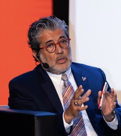 Beşir Kemal Ustaoğlu speaking on a panel